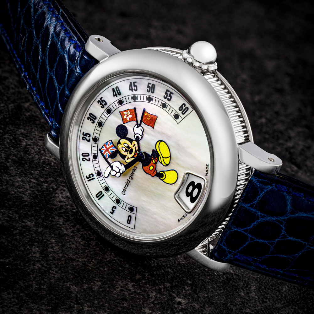 GERALD GENTA. A VERY RARE 18K WHITE GOLD LIMITED EDITION AUTOMATIC JUMP HOUR WRISTWATCH WITH RETROGRADE MINUTES AND MOTHER-OF-PEARL DIAL