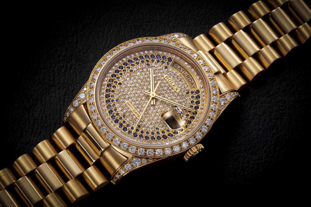 ROLEX, DAY-DATE REF. 18388, A GOLD AND DIAMOND-SET WRISWATCH WITH PAVED DIAMOND AND SAPPHIRE DIAL - CASE