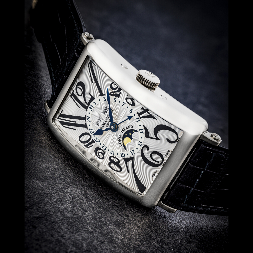 FRANCK MULLER. AN 18K WHITE GOLD AUTOMATIC TRIPLE CALENDAR WRISTWATCH WITH MOON PHASES