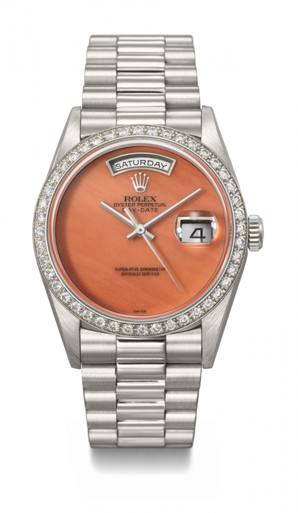 ROLEX. AN EXTREMELY RARE AND HIGHLY ATTRACTIVE PLATINUM AND DIAMOND-SET AUTOMATIC WRISTWATCH WITH SWEEP CENTRE SECONDS, DAY, DATE, CORAL DIAL AND BRACELET