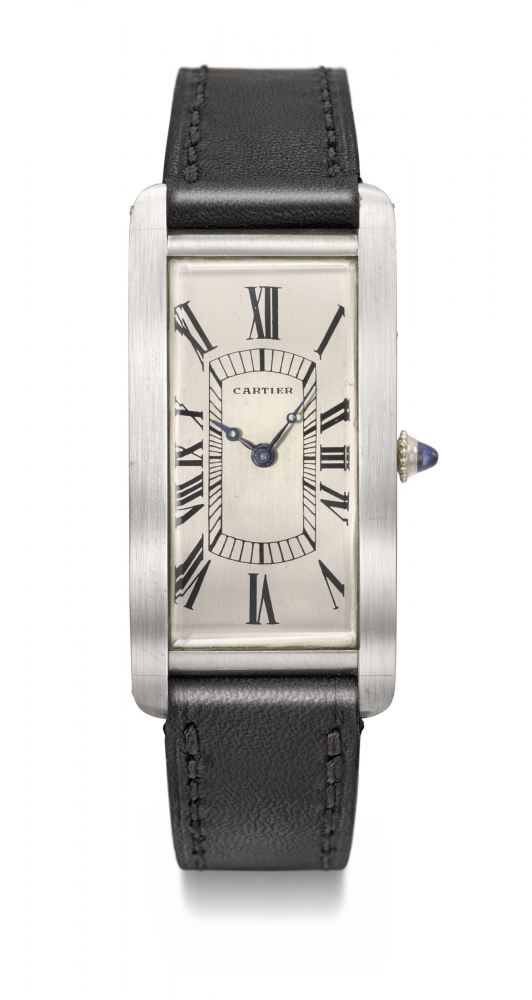 CARTIER. AN EXTREMELY RARE AND EARLY RECTANGULAR CURVED PLATINUM WRISTWATCH PRESENTED TO THE PRESENT OWNER’S FATHER, JULY 4, 1926