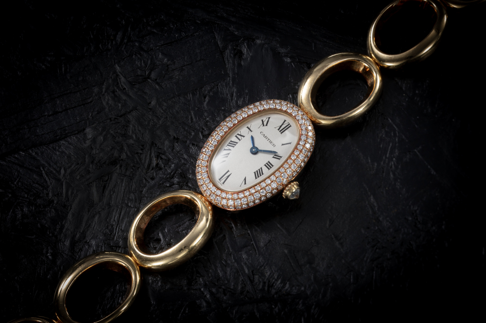 CARTIER, BAIGNOIRE REF.1967, AN ATTRACTIVE GOLD AND DIAMOND-SET BRACELET WATCH