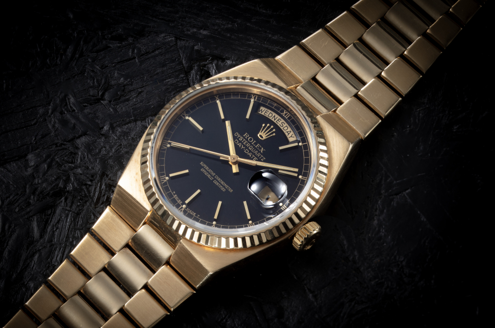 ROLEX, OYSTERQUARTZ DAY-DATE REF. 19018, AN ATTRACTIVE GOLD QUARTZ WRISWATCH WITH BRACELET