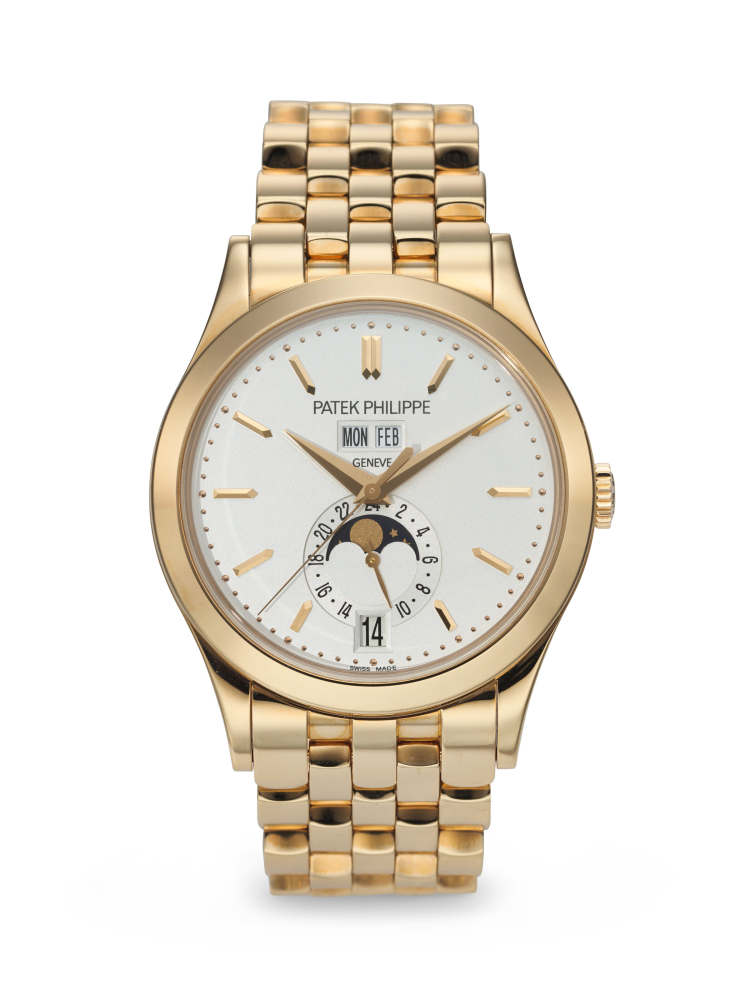 PATEK PHILIPPE. A RARE AND ATTRACTIVE 18K PINK GOLD AUTOMATIC ANNUAL CALENDAR WRISTWATCH WITH SWEEP CENTER SECONDS, MOON PHASES, 24-HOUR INDICATION, AND BRACELET