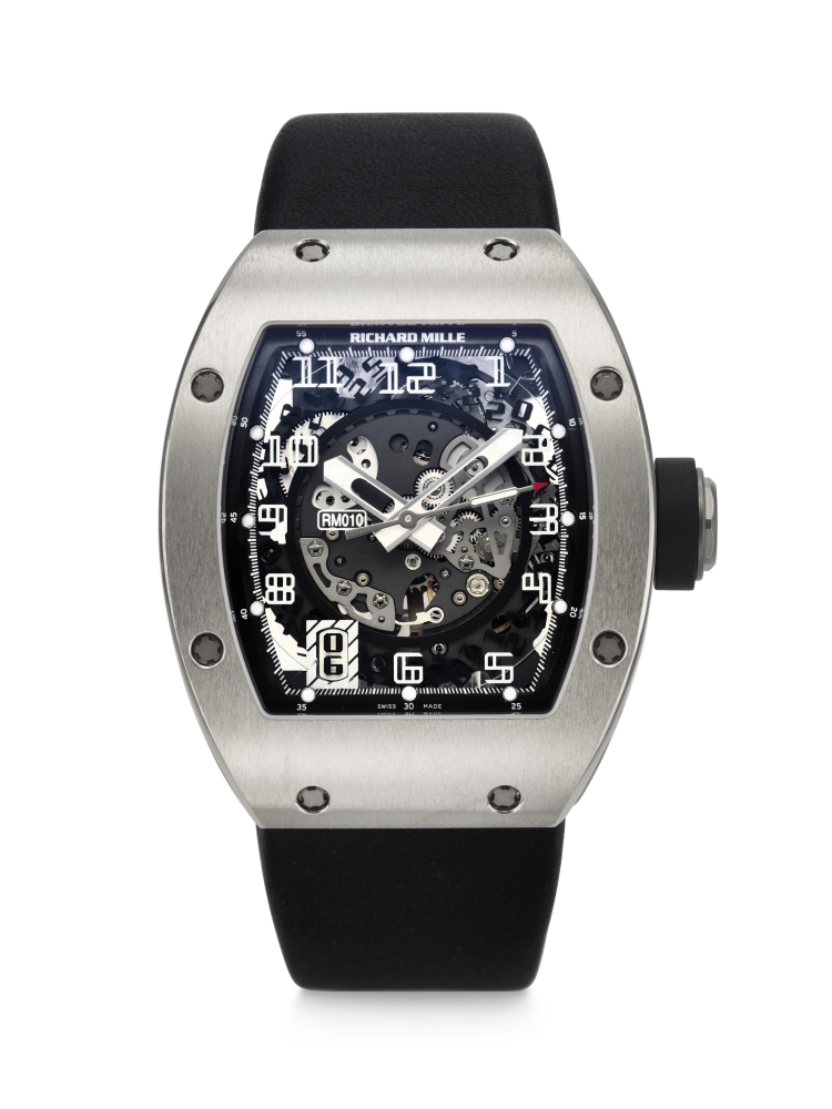 RICHARD MILLE. AN ATTRACTIVE AND SPORTY 18K WHITE GOLD AUTOMATIC SEMI-SKELETONIZED WRISTWATCH WITH SWEEP CENTER SECONDS AND DATE