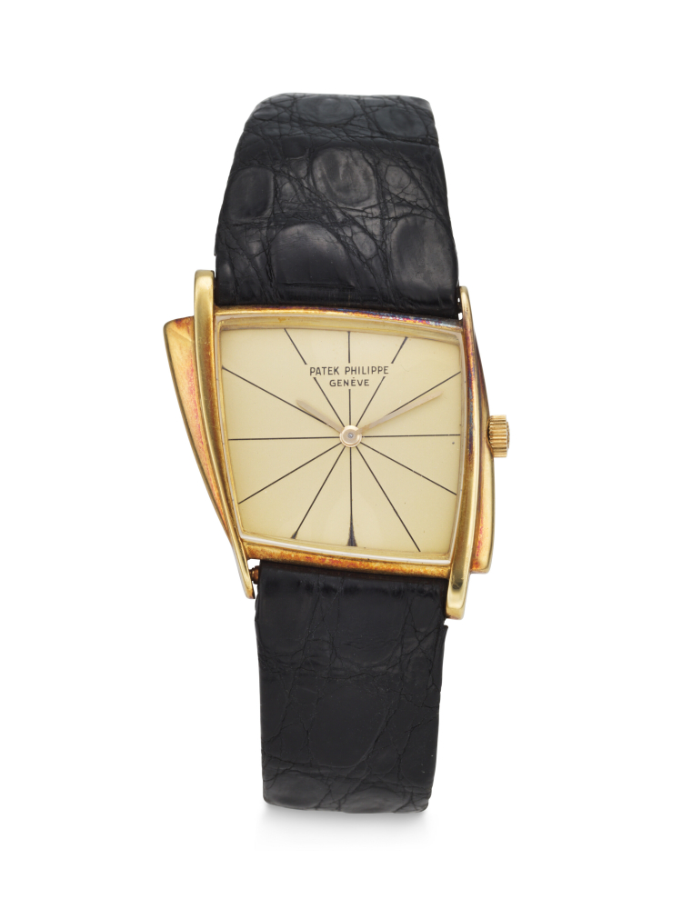 PATEK PHILIPPE. AN EXTREMELY RARE, UNUSUAL AND COVETED 18K GOLD ASYMMETRICAL WRISTWATCH, DESIGNED BY GILBERT ALBERT