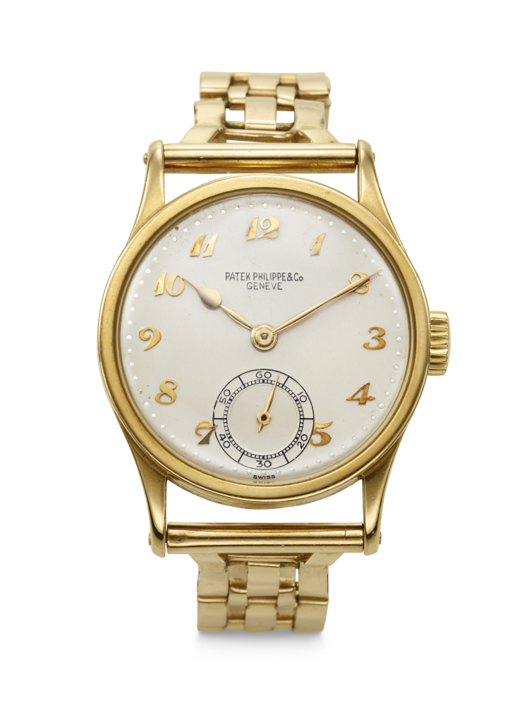PATEK PHILIPPE. A RARE AND DESIRABLE 18K GOLD WRISTWATCH WITH BREGUET NUMERALS