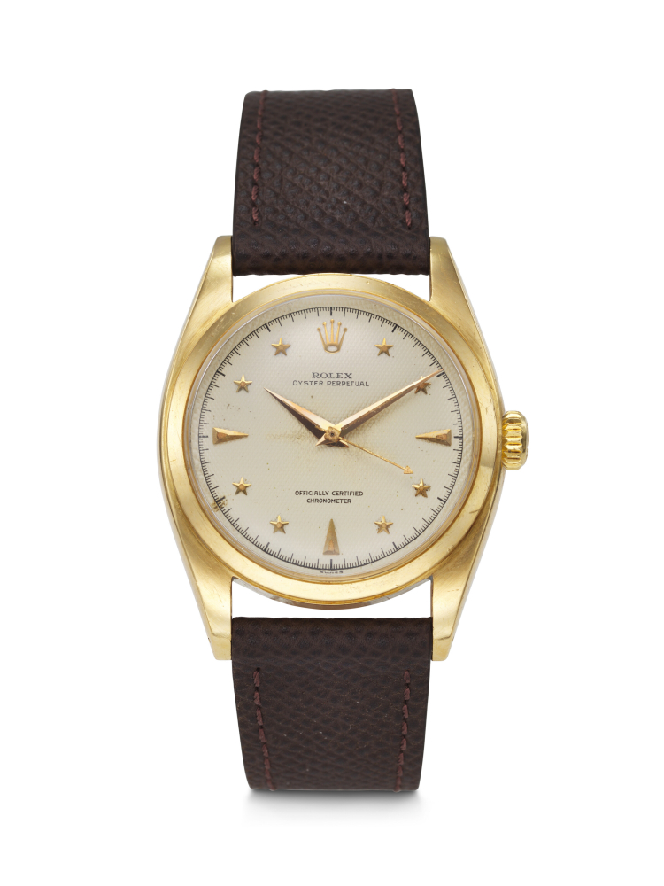 ROLEX. AN EXCEEDINGLY RARE AND HIGHLY ATTRACTIVE 18K GOLD AUTOMATIC WRISTWATCH WITH SWEEP CENTRE SECONDS AND LUMINOUS HONEYCOMB STAR DIAL