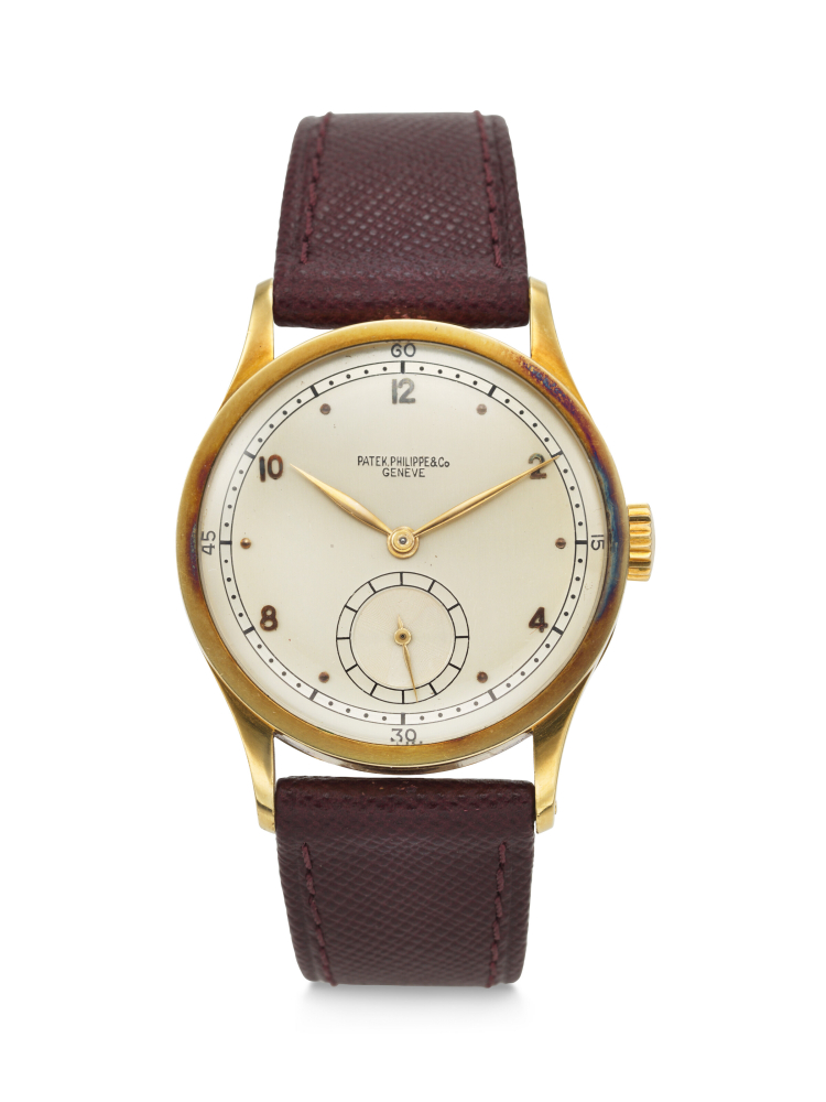 PATEK PHILIPPE. A RARE, HIGHLY ATTRACTIVE AND EARLY 18K GOLD WRISTWATCH WITH TWO-TONE DIAL
