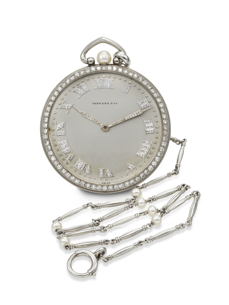 C.H. MEYLAN FOR TIFFANY & CO., AN OPULENT AND ULTRA-THIN PLATINUM, DIAMOND, AND PEARL-SET OPEN-FACE WATCH WITH PLATINUM AND PEARL CHAIN