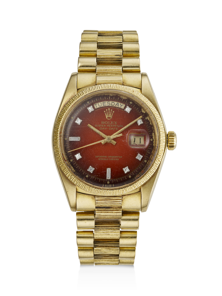 ROLEX, YELLOW GOLD AND DIAMOND-SET 'DAY-DATE', WITH RED VIGNETTE DIAL, REF. 1807