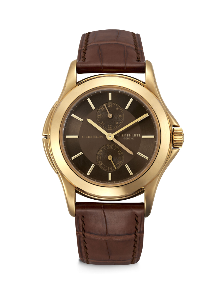 PATEK PHILIPPE. AN EXTREMELY RARE 18K GOLD LIMITED EDITION DUAL TIME WRISTWATCH WITH 24 HOUR INDICATION, MADE FOR THE 150TH ANNIVERSARY OF GÜBELIN 