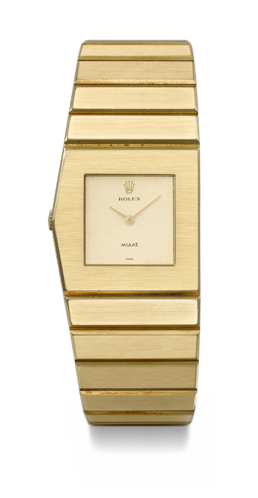 ROLEX. A RARE AND HEAVY 18K GOLD ASYMMETRIC LEFT HANDED WINDING WRISTWATCH WITH INTEGRAL 18K GOLD ‘KING MIDAS’ BRACELET