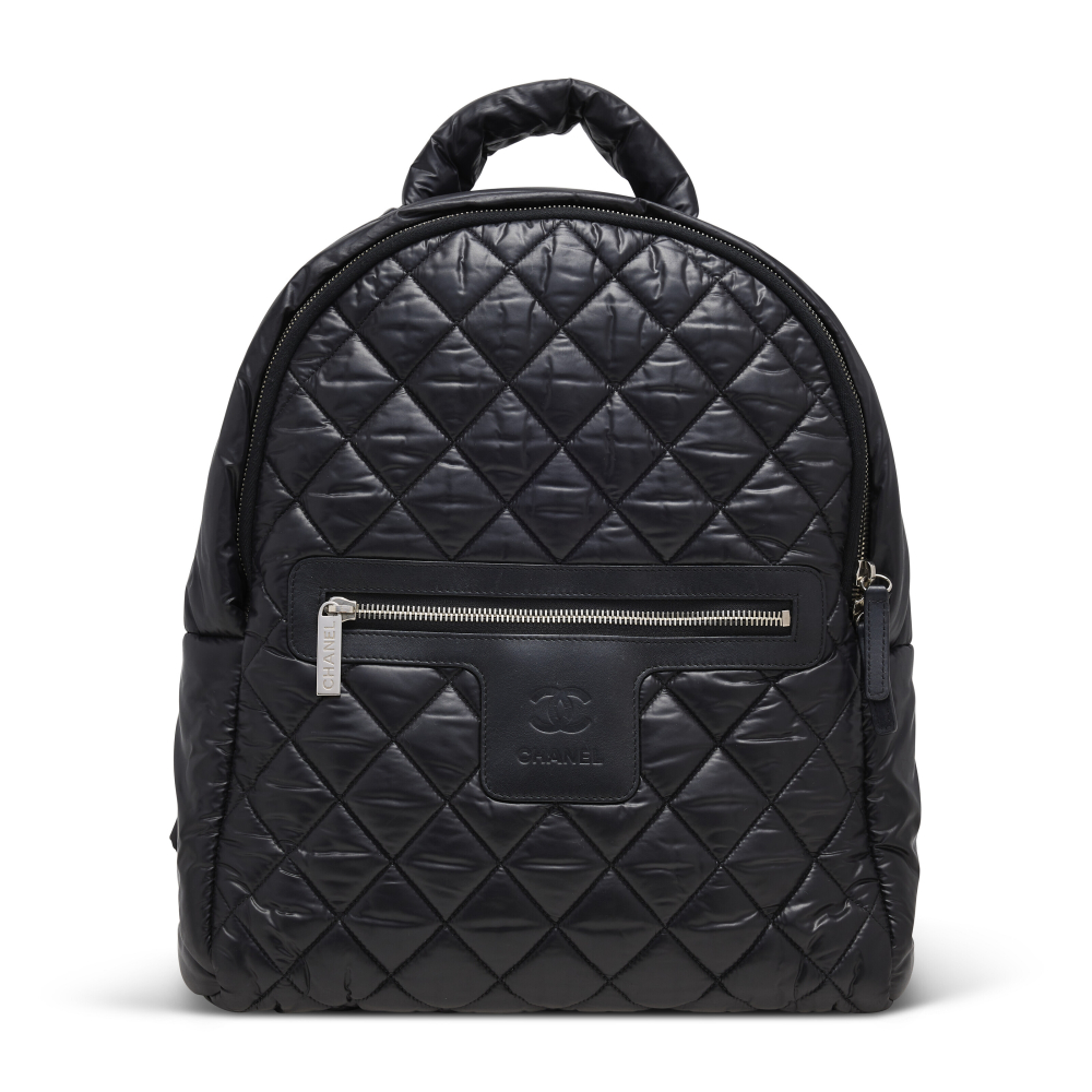 A BLACK QUILTED NYLON COCO COCOON BACKPACK WITH SILVER HARDWARE