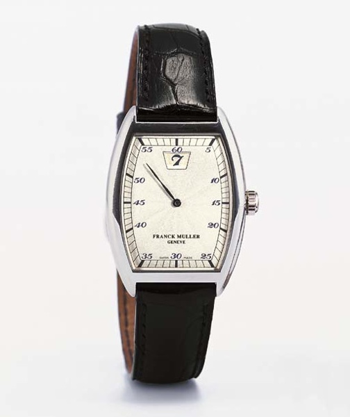 FRANCK MULLER. A PLATINUM TONNEAU-SHAPED JUMP HOUR WRISTWATCH