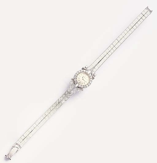 PIAGET. A LADY'S 18K WHITE GOLD AND DIAMOND-SET WRISTWATCH