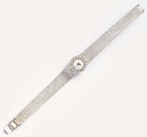 PIAGET. A LADY'S 18K WHITE GOLD AND DIAMOND-SET WRISTWATCH WITH BRACELET