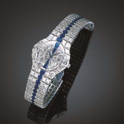 PIAGET. A MAGNIFICENT 18K WHITE GOLD, DIAMOND AND SAPPHRE-SET OVAL WRISTWATCH WITH BRACELET