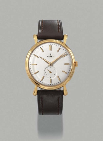 Rolex. A large 18K gold self-winding wristwatch