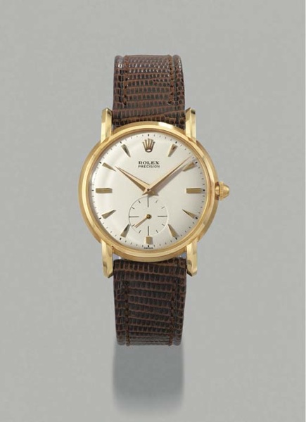 Rolex. An 18K gold wristwatch