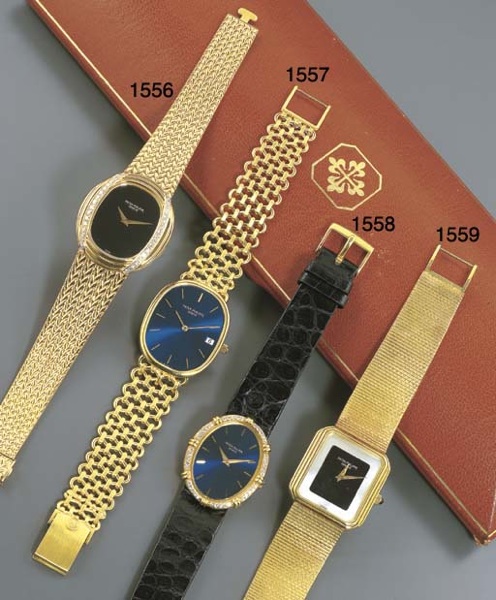 PATEK PHILIPPE. A LADY'S 18K GOLD AND DIAMOND-SET OVAL WRISTWATCH