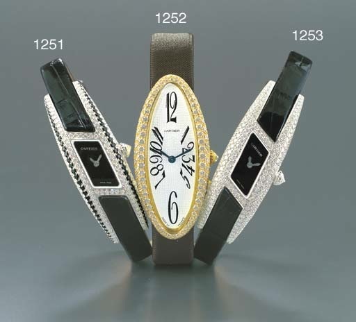 CARTIER. A LADY'S 18K WHITE GOLD AND DIAMOND-SET PARALLELOGRAM-SHAPED WRISTWATCH
