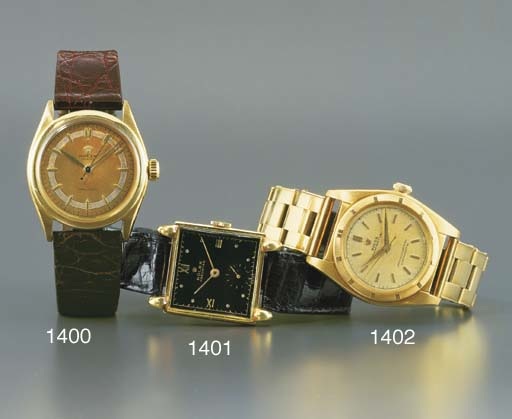 ROLEX. A 14K GOLD SQUARE WRISTWATCH