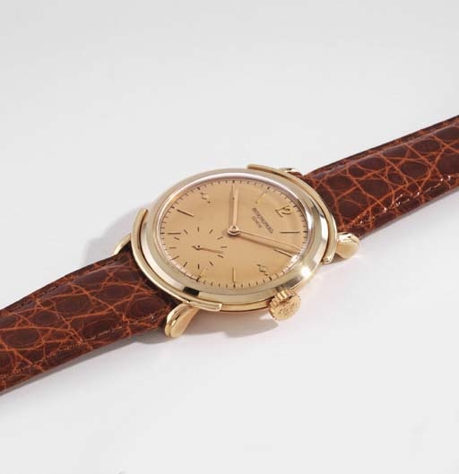 Patek Philippe. A very fine and rare 18K pink gold wristwatch with pink dial