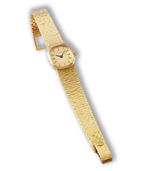 Patek Philippe. A ladies 18K gold oval wristwatch with bracelet