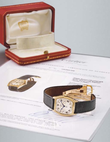 Cartier. An extremely fine and rare 18K gold tonneau-shaped single button chronograph wristwatch with register