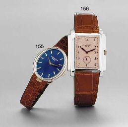 PATEK PHILIPPE. A LADY'S 18K WHITE GOLD OVAL WRISTWATCH