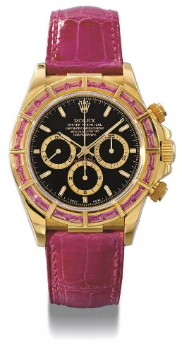 Rolex. A fine and rare 18K gold and sapphire-set waterproof chronograph wristwatch with special black dial