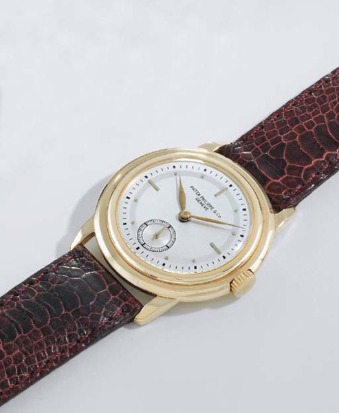 Patek Philippe. An unusual 18K gold mid-size wristwatch with two-tone silvered dial