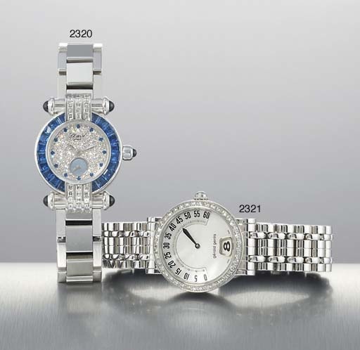 GERALD GENTA. A LADY'S STAINLESS STEEL AND DIAMOND-SET JUMP HOUR RETROGRADE WRISTWATCH WITH BRACELET AND MOTHER-OF-PEARL DIAL