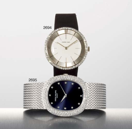 PATEK PHILIPPE. AN 18K WHITE GOLD AND DIAMOND-SET OVAL AUTOMATIC WRISTWATCH WITH BRACELET
