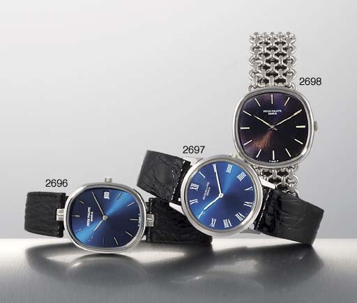 PATEK PHILIPPE. A STAINLESS STEEL OVAL WRISTWATCH WITH DATE