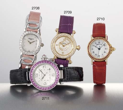 BREGUET. A LADY'S 18K GOLD, DIAMOND AND RUBY-SET AUTOMATIC WRISTWATCH WITH SWEEP CENTRE SECONDS, DATE AND MOTHER-OF-PEARL DIAL
