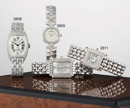 FRANCK MULLER. A LADY'S 18K WHITE GOLD AND DIAMOND-SET TONNEAU-SHAPED WRISTWATCH