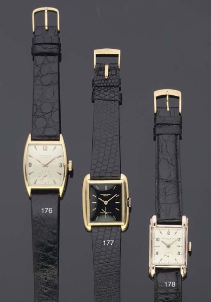 Patek Philippe. An 18ct Gold Tonneau Shaped Curved Back Wristwatch