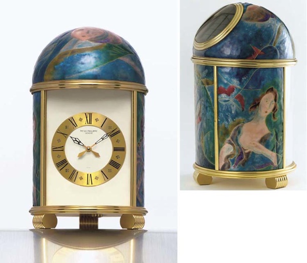 PATEK PHILIPPE. A FINE AND POSSIBLY UNIQUE GILT BRASS AND ENAMEL SOLAR-POWERED TABLE CLOCK