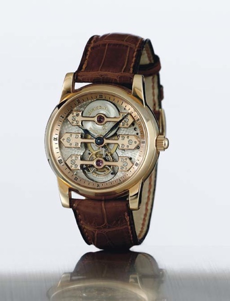 GIRARD-PERREGAUX. A FINE AND RARE 18K PINK GOLD SKELETONIZED TRIPLE BRIDGE TOURBILLON WRISTWATCH