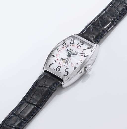 Franck Muller. A large 18K white gold tonneau-shaped self-winding curved triple calendar wristwatch with phases of the moon