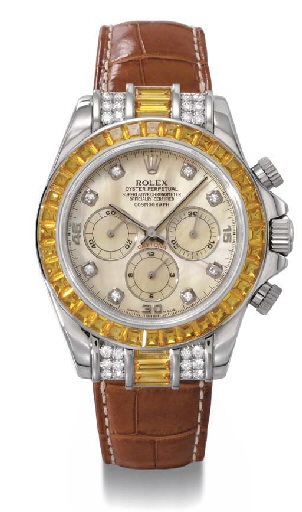 Rolex. A fine and rare custom-made 18K white gold, diamond and sapphire-set self-winding chronograph wristwatch with mother-of-pearl dial