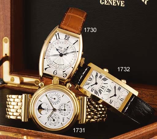 FRANCK MULLER. AN 18K GOLD TONNEAU-SHAPED AUTOMATIC TRIPLE CALENDAR WRISTWATCH WITH SWEEP CENTRE SECONDS