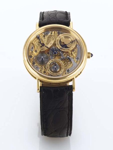 BREGUET. A FINE AND RARE 18K GOLD AUTOMATIC SKELETONIZED PERPETUAL CALENDAR WRISTWATCH WITH POWER RESERVE AND MOON PHASES