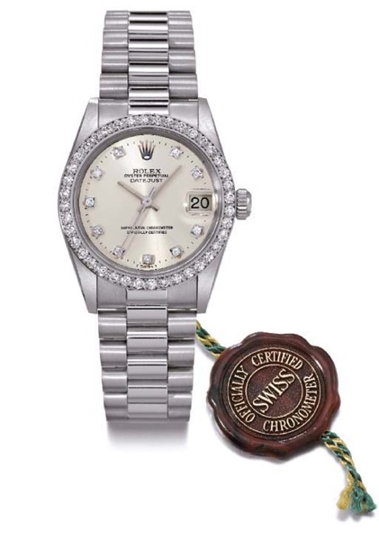 Rolex. An 18K white gold and diamond-set medium-size self-winding water-resistant wristwatch with sweep centre seconds, date and bracelet