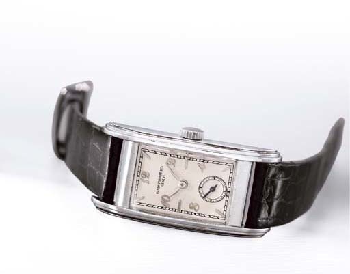 Patek Philippe. A fine, rare and large stainless steel rectangular curved wristwatch