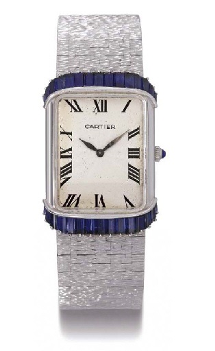 Piaget. A fine and unusual 18K white gold and sapphire-set rectangular-shaped wristwatch with bracelet
