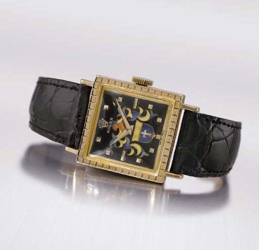 Rolex. An extremely fine and rare 18K gold square wristwatch with cloisonn