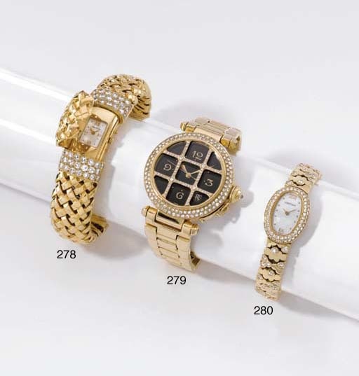 Cartier. A fine 18K gold and diamond-set self-winding wristwatch with sweep centre seconds, date and bracelet